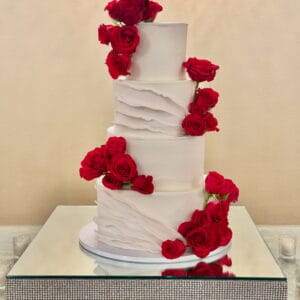 Rose themed 4 layered wedding cake